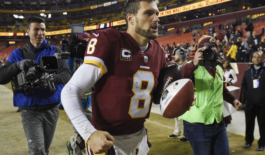 Washington Redskins quarterback Kirk Cousins (8) runs off the filed after an NFL football game against the New York Giants in Landover, Md., Friday, Nov. 24, 2017. The Redskins defeated the Giants 20-10. (AP Photo/Nick Wass)