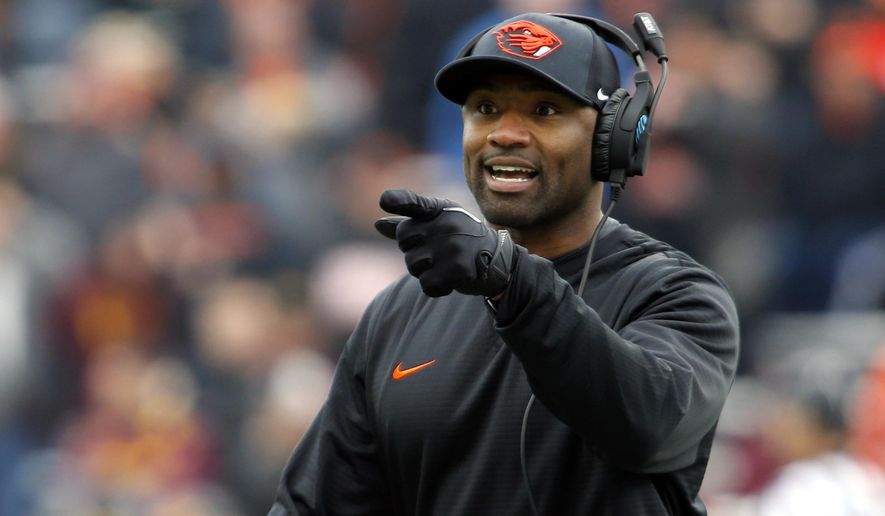 FILE - In this Nov. 18, 2917, file photo, Oregon State head coach Cory Hall gestures during an NCAA college football game, in Corvallis, Ore. Oregon and Oregon State head into the 121st Civil War game in Eugene, Ore., Saturday, Nov. 25, 2017, looking very different than last season. (AP Photo/Timothy J. Gonzalez, File)