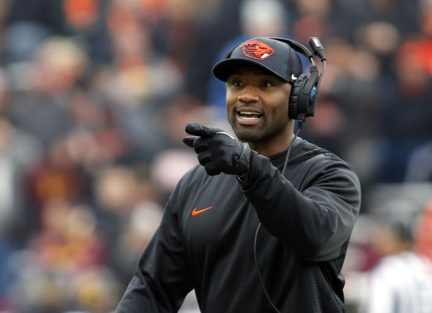 FILE - In this Nov. 18, 2917, file photo, Oregon State head coach Cory Hall gestures during an NCAA college football game, in Corvallis, Ore. Oregon and Oregon State head into the 121st Civil War game in Eugene, Ore., Saturday, Nov. 25, 2017, looking very different than last season. (AP Photo/Timothy J. Gonzalez, File)