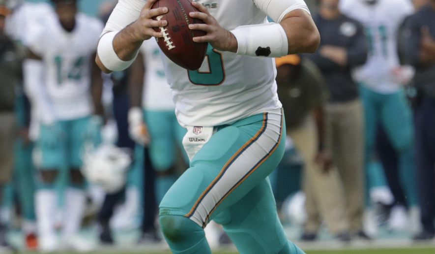 FILE - In this Sunday, Nov. 19, 2017, file photo, Miami Dolphins quarterback Matt Moore (8) looks to pass the ball during the second half of an NFL football game against the Tampa Bay Buccaneers, in Miami Gardens, Fla. The New England Patriots have won six straight and are again the team to beat in the AFC East. They will play five of their final six games against division opponents. First up is the Dolphins, on Sunday, Nov. 26, who have lost four straight and may have to give Moore his second start this season at quarterback with Jay Cutler in the concussion protocol. (AP Photo/Lynne Sladky, File)