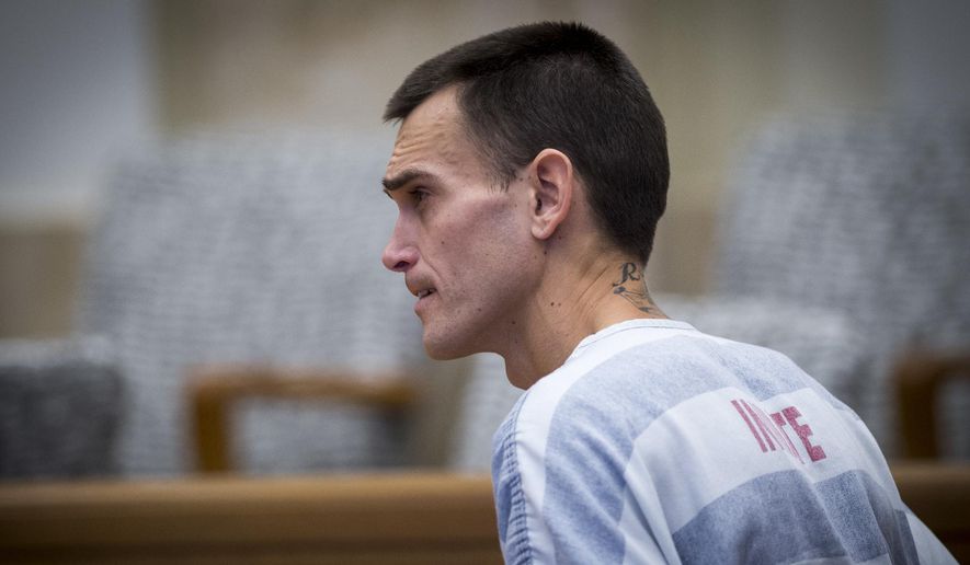 FILE - In this Nov. 2, 2017 file photo, Justin Rey appears in Johnson County District Court in Olathe, Kan. Rey, who was arrested after sleeping in a Kansas storage unit with his two children and his dismembered wife's remains has been charged in a California killing. Rey was charged Wednesday, Nov. 22 with murder in the death of Sean Ty Ferel. The Palm Springs, Calif., man disappeared in May 2016 after vacationing with Rey. (Tammy Ljungblad/The Kansas City Star via AP, Pool File)