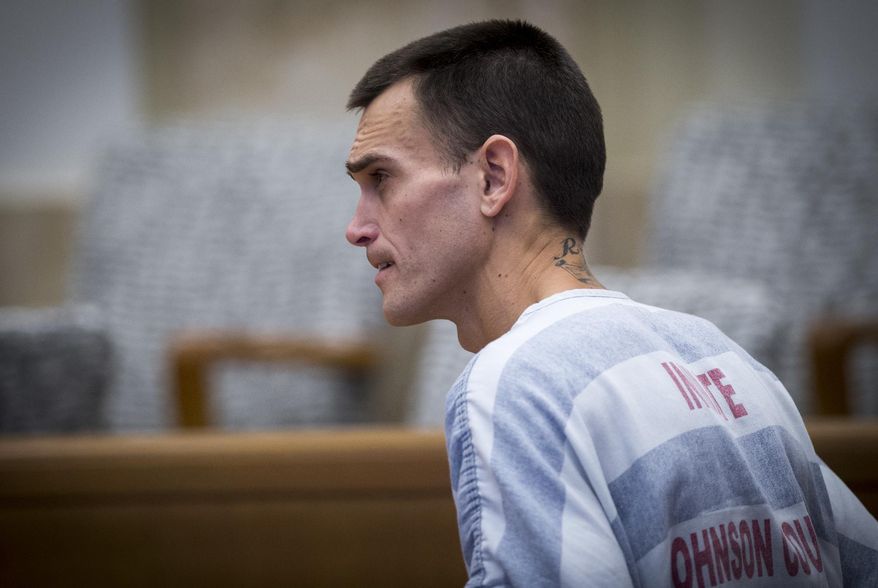FILE - In this Nov. 2, 2017 file photo, Justin Rey appears in Johnson County District Court in Olathe, Kan. Rey, who was arrested after sleeping in a Kansas storage unit with his two children and his dismembered wife's remains has been charged in a California killing. Rey was charged Wednesday, Nov. 22 with murder in the death of Sean Ty Ferel. The Palm Springs, Calif., man disappeared in May 2016 after vacationing with Rey. (Tammy Ljungblad/The Kansas City Star via AP, Pool File)