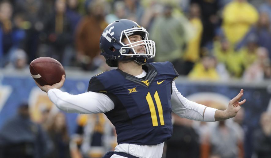 West Virginia quarterback Chris Chugunov (11) attempts a pass during the second half of an NCAA college football game against Texas, Saturday, Nov. 18, 2017, in Morgantown, W.Va. Texas defeated West Virginia 28-14. (AP Photo/Raymond Thompson)