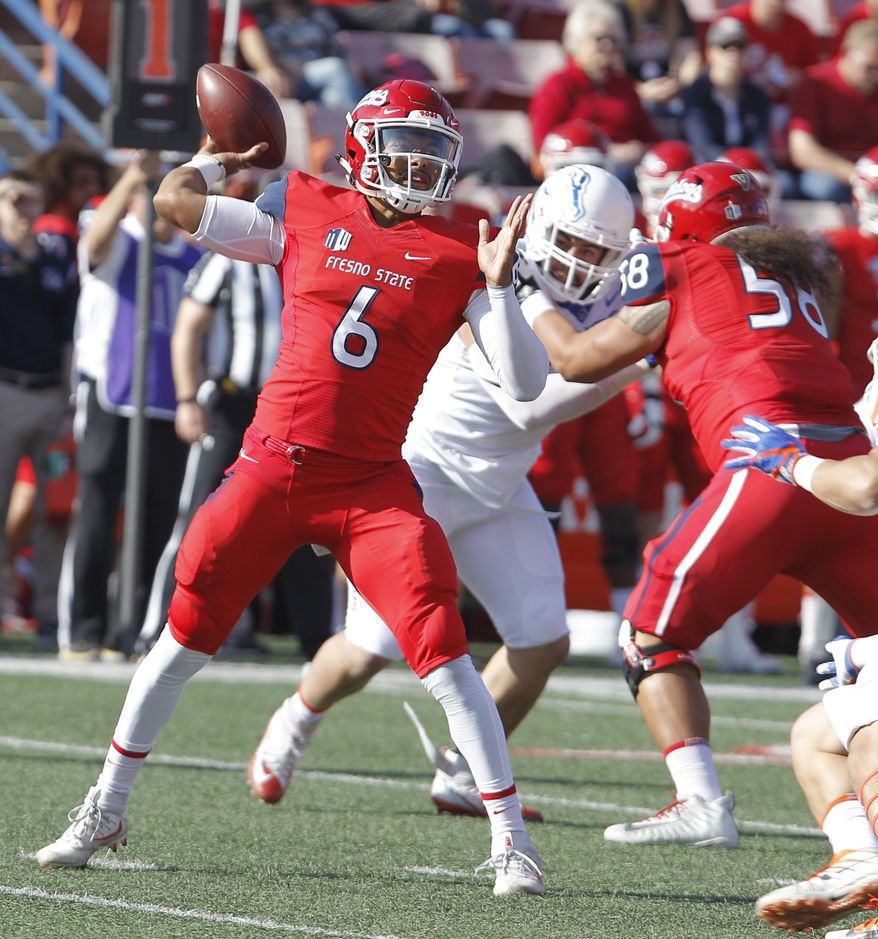Fresno State's quarterback Marcus McMaryion drops back to pass against Boise State during the first half of an NCAA college football game in Fresno, Calif., Saturday, Nov. 25 2017. (AP Photo/Gary Kazanjian)