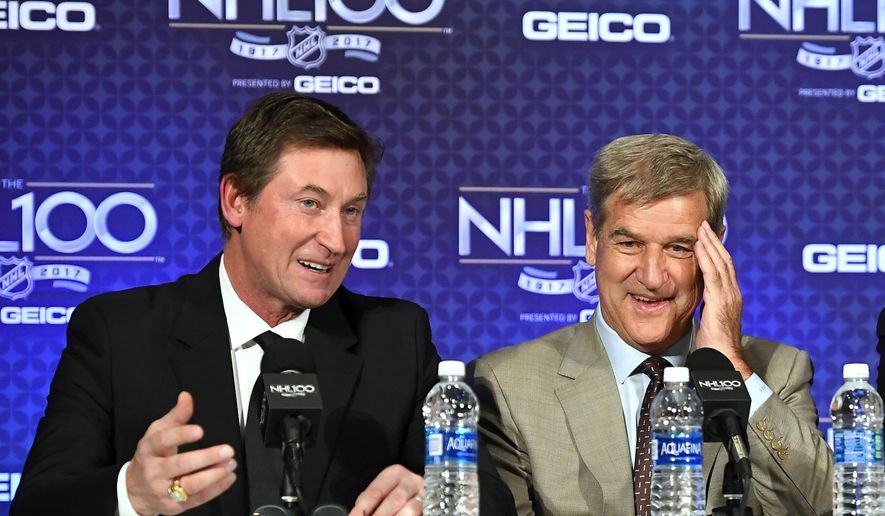 FILE - In this Jan. 27, 2017, file photo, former NHL hockey players Wayne Gretzky, left, and Bobby Orr speak during a news conference prior to an NHL 100 ceremony, in Los Angeles.  The NHL is wrapping up its centennial celebration with what executive Steve Mayer hopes is the “ultimate documentary” about the league’s first 100 years. It accomplished one thing: teaching even “The Great One” a history lesson.“I found out some interesting things about the game that I didn&#39;t know,”  Gretzky said.(AP Photo/Mark J. Terrill, File)