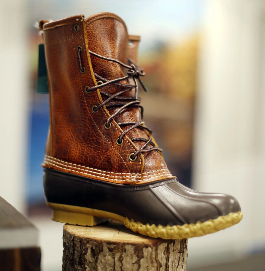 FILE - In this Aug. 17, 2017 file photo, a Bean Boot displayed at the L.L. Bean manufacturing center in Lewiston, Maine, Bean said it's in the midst of another record breaking year of sales for its iconic 'duck boot,' and there will be enough to meet the 2017 holiday crunch. (AP Photo/Robert F. Bukaty, File)