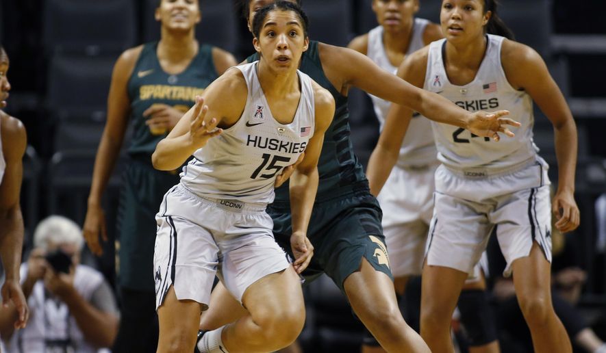 Connecticut&#39;s Gabby Williams (15) chases after a loose ball in the second half of an NCAA college basketball game against Michigan State during the Phil Knight Invitational tournament in Eugene, Ore., Saturday, Nov. 25, 2017. (AP Photo/Timothy J. Gonzalez)