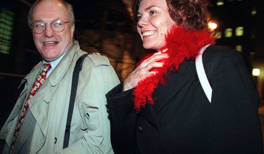 FILE - In this Dec. 7, 1999, file photo, attorney Michael Carey, left, and his client Anette Sorensen leave New York's U.S. District court after the second day of trial of her $20 million lawsuit against the city. The jury awarded her $66,000, rejecting many of her claims but agreeing that she should not have been strip-searched, among other findings. The Danish mother, whose 1997 arrest for leaving her baby outside a New York eatery sparked an international debate about parenting, says she still feels she was unfairly vilified. (AP Photo/Diane Bondareff, File)