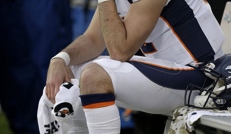 Denver Broncos quarterback Paxton Lynch (12) sits on the bench during the second half of an NFL football game against the Oakland Raiders in Oakland, Calif., Sunday, Nov. 26, 2017. (AP Photo/Ben Margot)