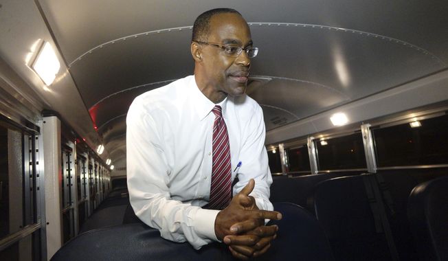 This Aug. 24, 2015 photo shows Broward School Board Superintendent Robert Runcie inside a bus in Pembroke Pines, Fla. The Florida Legislature recently changed state law to allow any resident to challenge their school district&#x27;s textbooks and curricula and get a hearing before an outside mediator. Runcie, who is also the president of the state superintendents association, said the changes are &amp;quot;cumbersome.&amp;quot; Districts have always encouraged parents and residents to voice concerns about materials and curricula, he said, and the mediator is an unnecessary step. (Joe Cavatetta/South Florida Sun-Sentinel via AP)