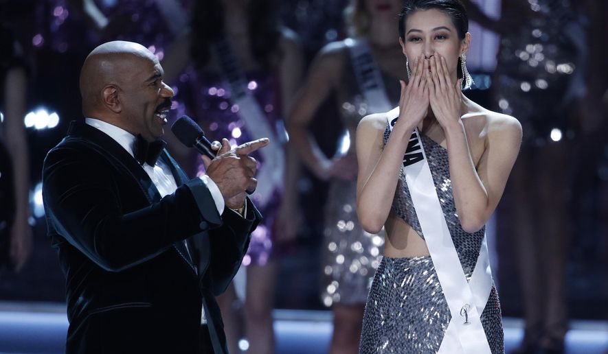 Miss China Roxette Qiu reacts as she is interviewed by Steve Harvey at the Miss Universe pageant Sunday, Nov. 26, 2017, in Las Vegas. (AP Photo/John Locher)