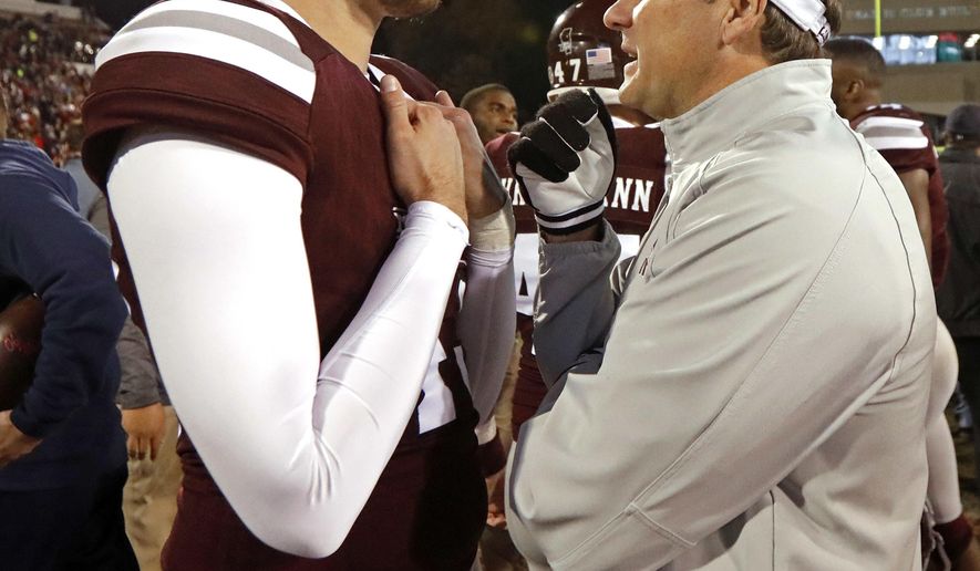 Mississippi State coach Dan Mullen speaks with punter Logan Cooke following the team's 31-28 loss to Mississippi in an NCAA college football game in Starkville, Miss., Thursday, Nov. 23, 2017. (AP Photo/Rogelio V. Solis)