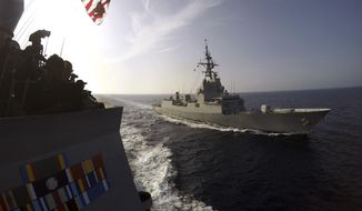 In this Oct. 5, 2016, photo released by the U.S. Navy, the Spanish Navy frigate Alvaro de Bazan, right, cruises alongside the destroyer USS Carney, left, off the coast of Rota, Spain, in the Mediterranean Sea. Bath Iron Works in Bath, Maine, said in November 2017 it is partnering with the Spanish builder of the Alvaro de Bazan on a new design for up to 20 frigates for the U.S. Navy. (Weston Jones/U.S. Navy via AP)