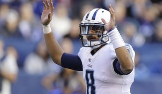 Tennessee Titans quarterback Marcus Mariota (8) reacts after a 1-yard touchdown run by running back DeMarco Murray during the second half of an NFL football game against the Indianapolis Colts, Sunday, Nov. 26, 2017, in Indianapolis. (AP Photo/Darron Cummings)