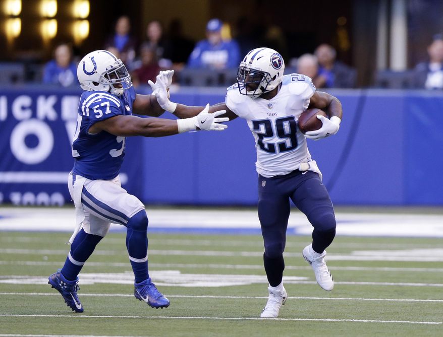 Tennessee Titans' DeMarco Murray (29) runs against Indianapolis Colts' Jon Bostic (57) during the second half of an NFL football game, Sunday, Nov. 26, 2017, in Indianapolis. Tennessee won 20-16. (AP Photo/Michael Conroy)