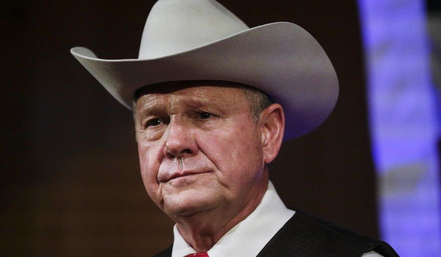 Former Alabama Chief Justice and U.S. Senate candidate Roy Moore speaks at a rally, in Fairhope, Ala. President Donald Trump in tweets Sunday, Nov. 26, is again coming to the side of Moore by bashing the Democratic nominee Doug Jones in the Alabama Senate race. (AP Photo/Brynn Anderson, File)