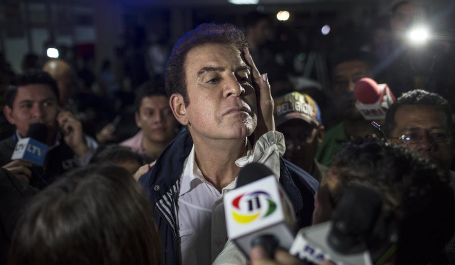 Opposition Alliance presidential candidate Salvador Nasralla, center, talks to the press after a press conference in Tegucigalpa, Honduras, Monday, Nov. 27, 2017. Hondurans waited anxiously with no results released hours after polls closed for Sunday&#39;s presidential election, while both the president and his main challenger claimed victory after what appeared to be a heavy turnout by voters. (AP Photo/Rodrigo Abd)