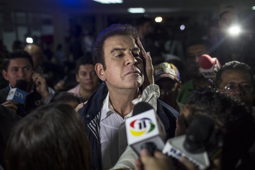 Opposition Alliance presidential candidate Salvador Nasralla, center, talks to the press after a press conference in Tegucigalpa, Honduras, Monday, Nov. 27, 2017. Hondurans waited anxiously with no results released hours after polls closed for Sunday&#39;s presidential election, while both the president and his main challenger claimed victory after what appeared to be a heavy turnout by voters. (AP Photo/Rodrigo Abd)