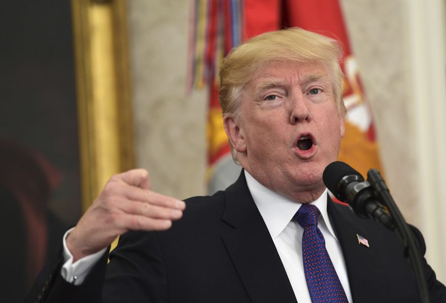 President Donald Trump responds to a question at the end of a meeting with Navajo Code Talkers in the Oval Office of the White House in Washington, Monday, Nov. 27, 2017. (AP Photo/Susan Walsh)
