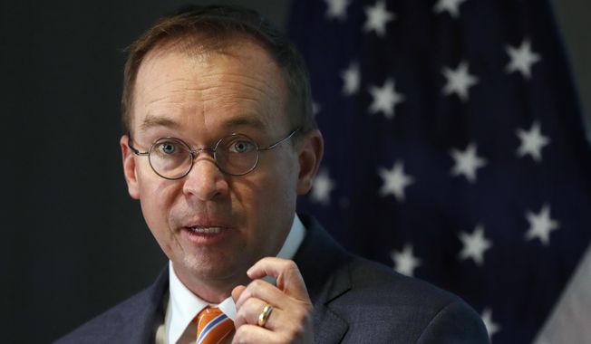 Mick Mulvaney speaks during a news conference after his first day as acting director of the Consumer Financial Protection Bureau in Washington, Monday, Nov. 27, 2017. (AP Photo/Jacquelyn Martin) ** FILE **