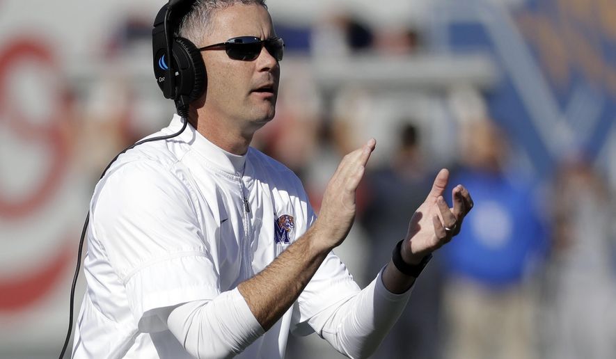 Memphis head coach Mike Norvell cheers his players after a touchdown against East Carolina in the first half of an NCAA college football game Saturday, Nov. 25, 2017, in Memphis, Tenn. (AP Photo/Mark Humphrey)