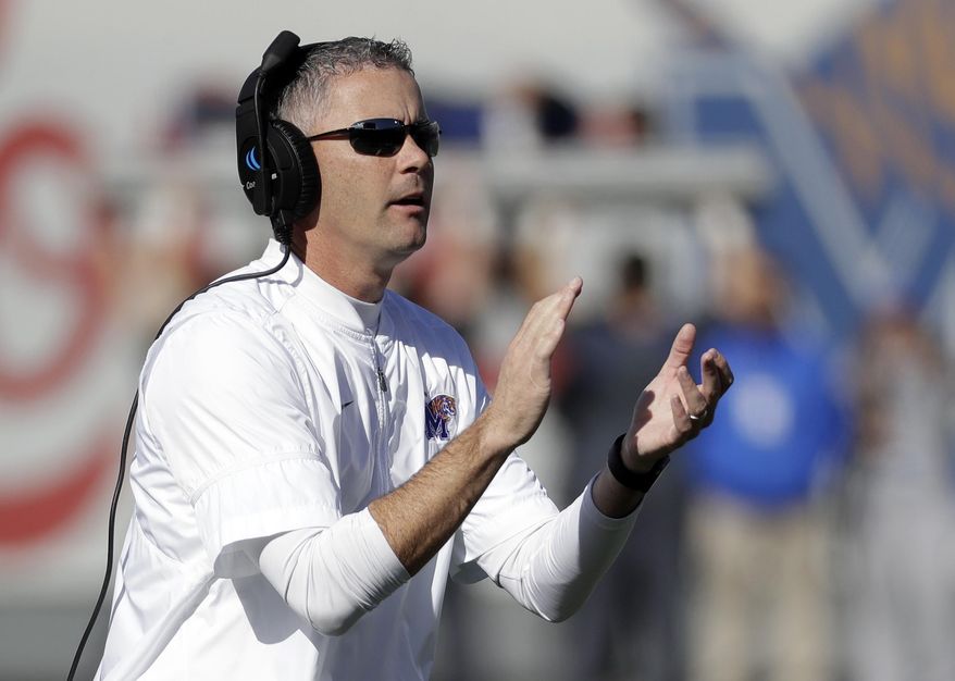 Memphis head coach Mike Norvell cheers his players after a touchdown against East Carolina in the first half of an NCAA college football game Saturday, Nov. 25, 2017, in Memphis, Tenn. (AP Photo/Mark Humphrey)