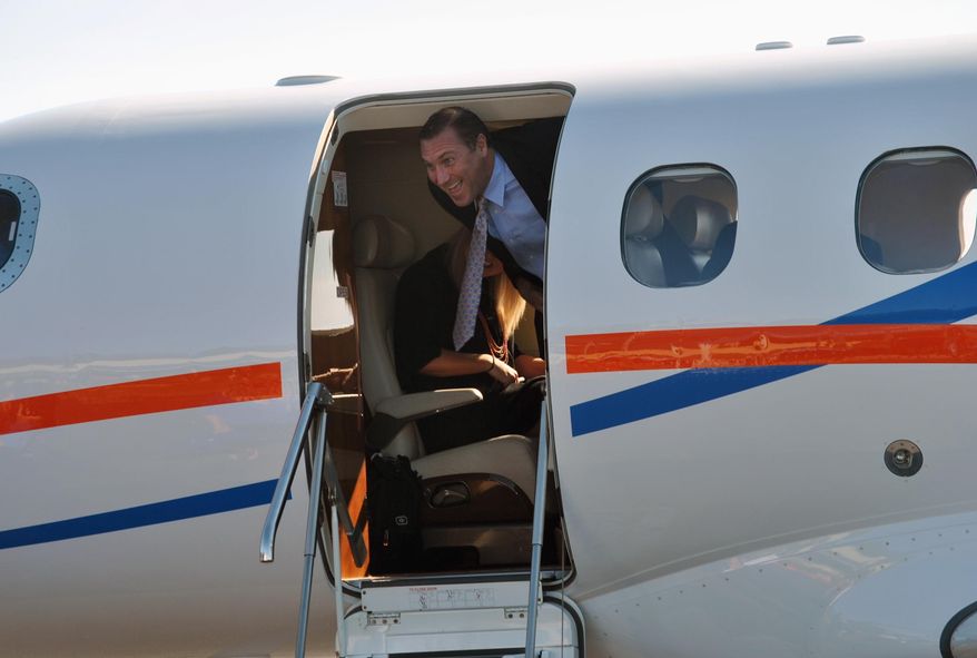 University of Florida's new NCAA college football coach Dan Mullen smiles as he arrives at the airport in Gainesville, Fla., Monday, Nov. 27, 2017. (AP Photo/Mark Long)