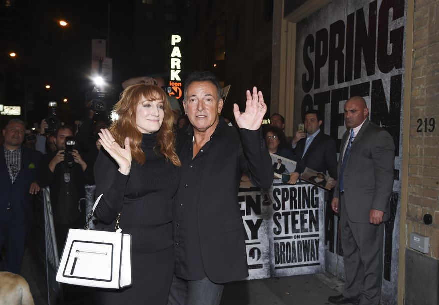 FILE - In this Oct. 12, 2017 file photo, musician Bruce Springsteen and his wife Patti Scialfa exit out the stage door after the "Springsteen On Broadway" opening night performance in New York. Springsteen said Monday, Nov. 27, that his one-man show will extend a second time to June 30. He had previously planned to end in February. (Photo by Evan Agostini/Invision/AP, File)