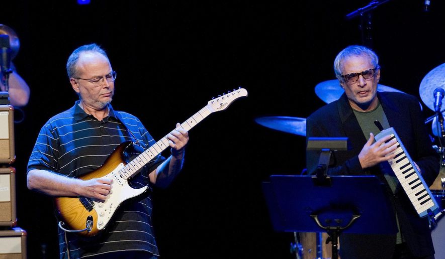 FILE - In this July 4, 2009 file photo, Walter Becker, left, and Donald Fagen, of the U.S. group Steely Dan performs at the 43nd Montreux Jazz Festival, in Montreux, Switzerland. Fagen is suing the estate of his late band mate, Becker, over ownership of the band’s name and music, a move Becker’s representatives are calling “unwarranted and frivolous.” (AP Photo/Keystone, Jean-Christophe Bott, File)
