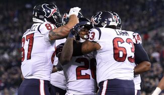 Houston Texans running back Lamar Miller, center, celebrates his touchdown with teammates in the first half of an NFL football game against the Baltimore Ravens, Monday, Nov. 27, 2017, in Baltimore. (AP Photo/Gail Burton)