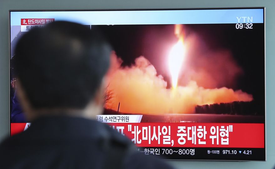 A man watches a TV screen showing a local news program reporting with a file footage of North Korea's missile launch, at the Seoul Railway Station in Seoul, South Korea, Wednesday, Nov. 29, 2017. After 2 ½ months of relative peace, North Korea launched its most powerful weapon yet early Wednesday, a presumed intercontinental ballistic missile that could put Washington and the entire eastern U.S. seaboard within range. The letters read "North Korea's missile launch, serious threat." (AP Photo/Lee Jin-man)