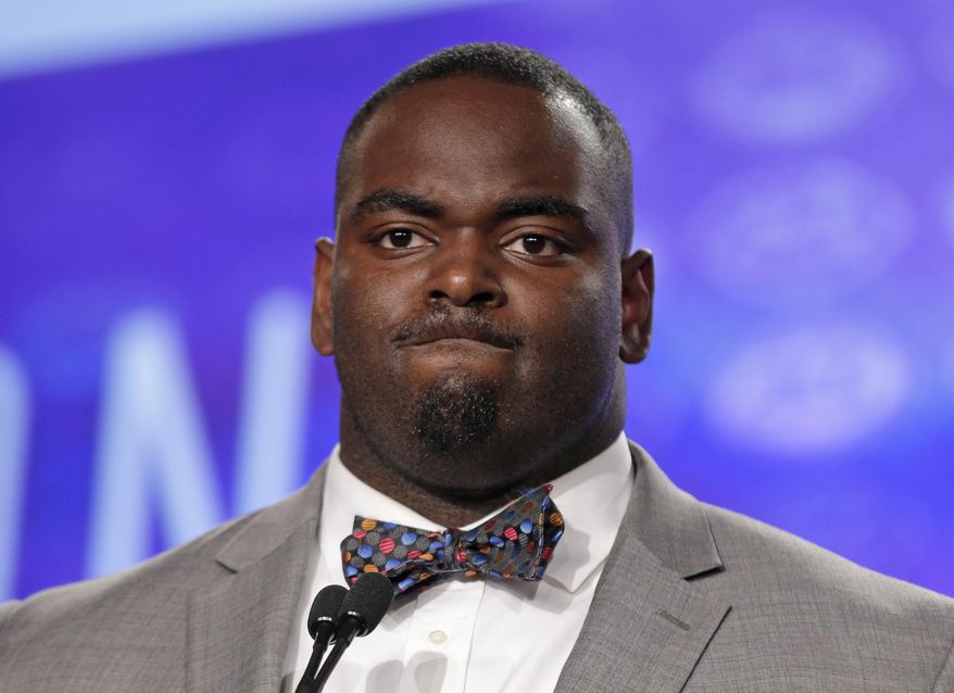 FILE - In this July 13, 2017, file photo, Clemson's Tyrone Crowder listens to a question during the Atlantic Coast Conference NCAA college football media day in Charlotte, N.C. Clemson has the ACC’s best offensive line with Crowder and offensive tackle Mitch Hyatt both among the best in the country at their positions. (AP Photo/Chuck Burton, File)