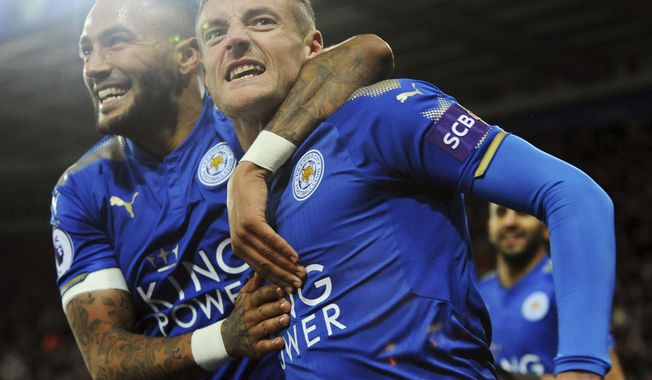 Leicester&#x27;s Jamie Vardy, right, celebrates with Leicester&#x27;s Danny Simpson after scoring during the English Premier League soccer match between Leicester City and Tottenham Hotspur at the King Power Stadium in Leicester, England, Tuesday, Nov. 28, 2017. (AP Photo/Rui Vieira)