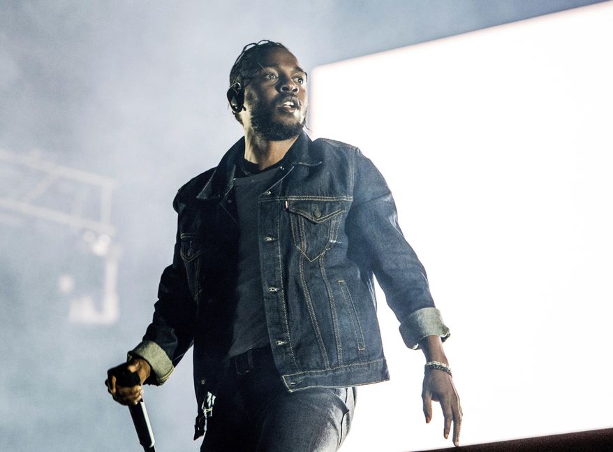 FILE - In this July 7, 2017, file photo, Kendrick Lamar performs during the Festival d'ete de Quebec in Quebec City, Canada. Lamar was nominated for seven Grammy nominations on Tuesday, Nov. 28. The 60th Annual Grammy Awards will air on CBS, Sunday, Jan. 28, 2018, in New York. (Photo by Amy Harris/Invision/AP, File)
