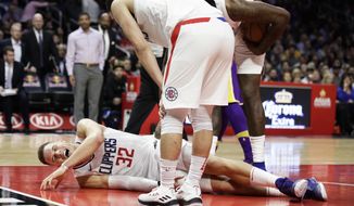 Los Angeles Clippers&#x27; Blake Griffin grimaces in pain after a collision during the second half of an NBA basketball game against the Los Angeles Lakers, Monday, Nov. 27, 2017, in Los Angeles. The Clippers 120-115. (AP Photo/Jae C. Hong)