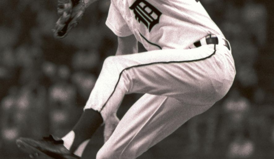 FILE - In this June 16, 1977, file photo, Detroit Tigers&#39; Mark Fidrych pitches to the Toronto Blue Jays during a baseball game in Detroit. A Massachusetts appeals court has dismissed a wrongful-death lawsuit filed by the widow of former Major League pitcher Mark Fidrych. Court records show the 54-year-old died of asphyxiation in 2009 after his clothing became tangled in a spinning piece of a dump truck he was working on. Ann Pantazis filed a lawsuit in 2012 against the makers of the truck and the spinning component, arguing they did not provide sufficient warnings. The court ruled unanimously Monday, Nov. 27, 2017, the companies did provide warnings and the equipment had no design defects. (AP Photo/File)