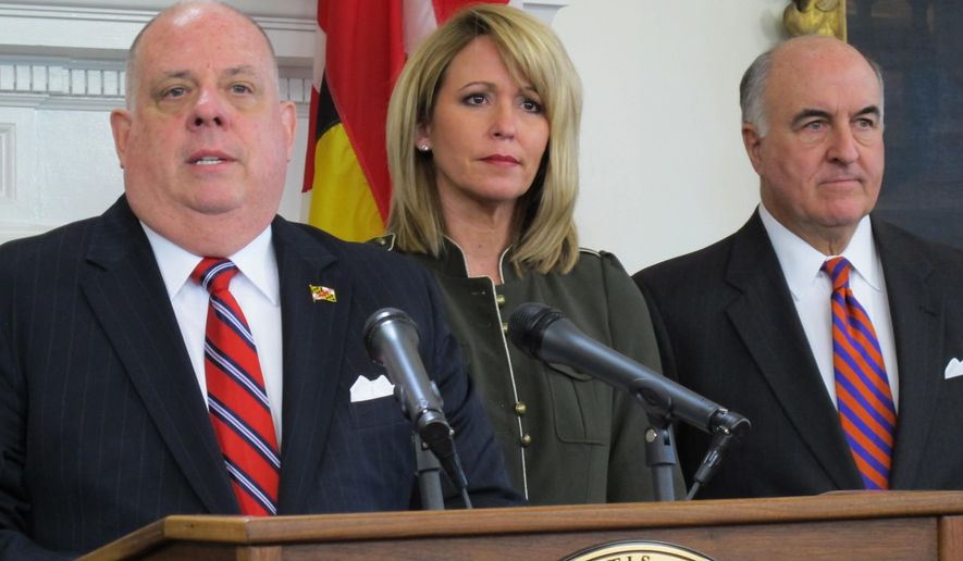 Maryland Gov. Larry Hogan, left, announces plans for a new paid sick leave measure that would phase in a requirement of five days of paid sick leave over three years for businesses with 25 or more employees during a news conference Tuesday, Nov. 28, 2017 in Annapolis, Md. Maryland Secretary of Labor, Licensing and Regulation Kelly Schulz is standing next to Hogan. Maryland Secretary of Commerce R. Michael Gill is standing right. The Maryland General Assembly passed a bill earlier this year to require businesses with 15 or more employees to provide paid sick leave, but Hogan vetoed the bill. (AP Photo/Brian Witte)