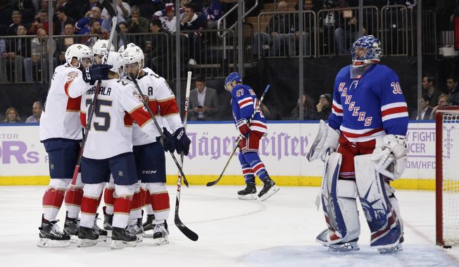 The Florida Panthers celebrate a goal against the New York Rangers during the first period of an NHL hockey game, Tuesday, Nov. 28, 2017, in New York. (AP Photo/Julie Jacobson)