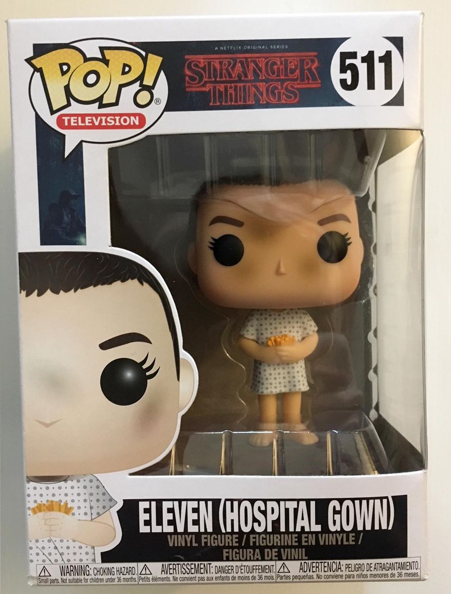 This Nov. 27, 2017 photo shows a collectible figure of the character Eleven from the Netflix series, "Stranger Things." (AP Photo/Lynn Elber)