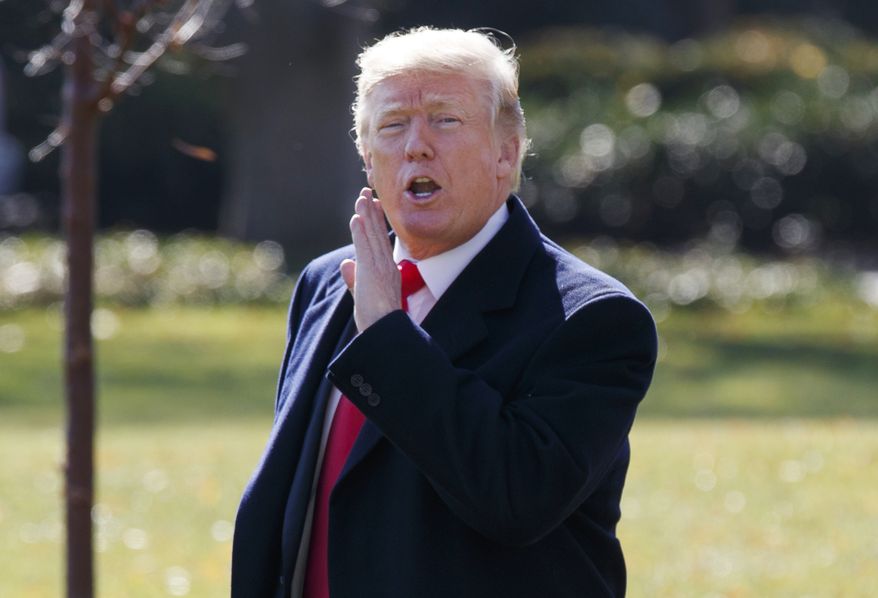 President Donald Trump yells to reporters as he walks to board Marine One on the South Lawn of the White House, Wednesday, Nov. 29, 2017, in Washington. Trump is returning to Missouri on Wednesday as he tries to push the Republican tax plan across the finish line. (AP Photo/Evan Vucci)