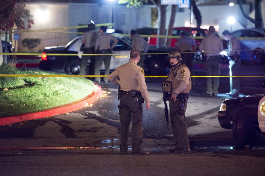 Deputies work on the scene after a shooting Tuesday, Nov. 28, 2017, in Santa Clarita, Calif. A Los Angeles County sheriff’s deputy and a suspect were both shot and wounded in gun battle late Tuesday, authorities said. (Hans Gutknecht/Los Angeles Daily News via AP)