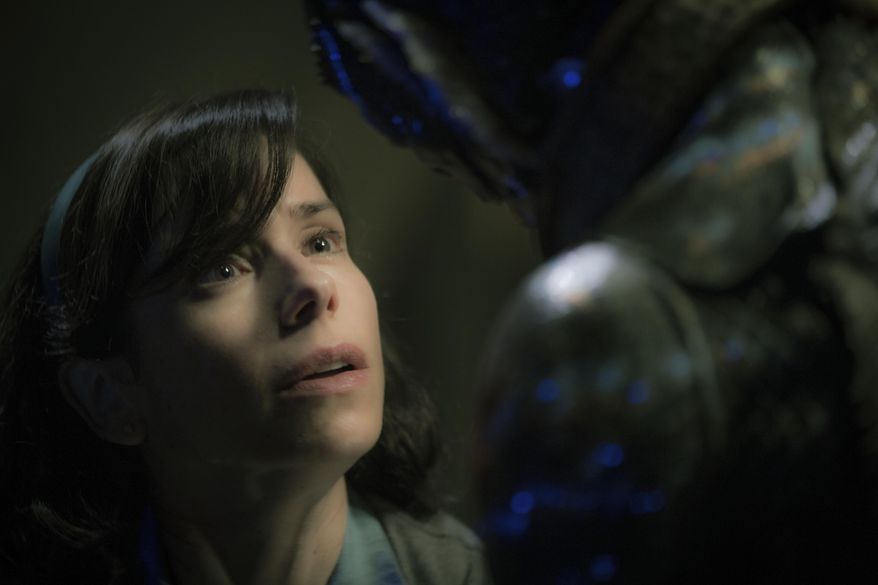 This image released by Fox Searchlight Pictures shows Sally Hawkins, left, and Doug Jones in a scene from the film "The Shape of Water." (Kerry Hayes/Fox Searchlight Pictures via AP)