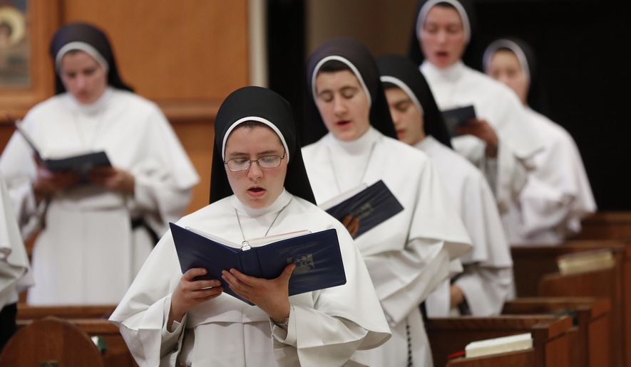In this Nov. 14, 2017 photo, sisters sing at the Dominican Sisters of Mary, Mother of the Eucharist campus in Ann Arbor, Mich. Their third and latest album, “Jesu, Joy of Man’s Desiring: Christmas with the Dominican Sisters of Mary,” has muscled its way to the top of Billboard’s classical chart and climbed nearly as high on the holiday chart. (AP Photo/Paul Sancya)