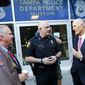 Florida Gov. Rick Scott, right, talks with Tampa Police Chief Brian Dugan, center, and Tampa Mayor Bob Buckhorn, left, outside Tampa Police Headquarters in Tampa, Fla. on Wednesday, Nov. 29, 2017. Scott&#39;s visit followed the announcement of the arrest in the Seminole Heights murders. (Will Vragovic/Tampa Bay Times via AP)