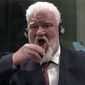In this photo provided by the ICTY on Wednesday, Nov. 29, 2017, Slobodan Praljak brings a bottle to his lips, during a Yugoslav War Crimes Tribunal in The Hague, Netherlands. Praljak yelled, &amp;quot;I am not a war criminal!&amp;quot; and appeared to drink from a small bottle, seconds after judges reconfirmed his 20-year prison sentence for involvement in a campaign to drive Muslims out of a would-be Bosnian Croat ministate in Bosnia in the early 1990s. (ICTY via AP)