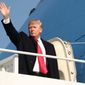 President Trump boards Air Force One on Wednesday, poised to travel to Missouri and speak to local citizens about the tax reform effort. (Associated Press)