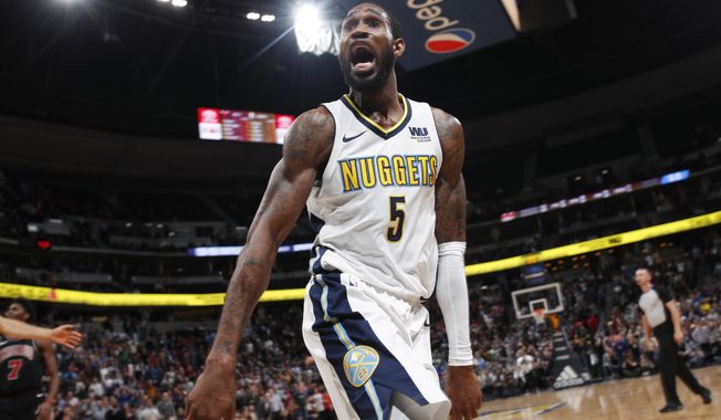 Denver Nuggets guard Will Barton celebrates after hitting the winning basket against the Chicago Bulls in an NBA basketball game Thursday, Nov. 30, 2017, in Denver. The Nuggets won 111-110. (AP Photo/David Zalubowski)