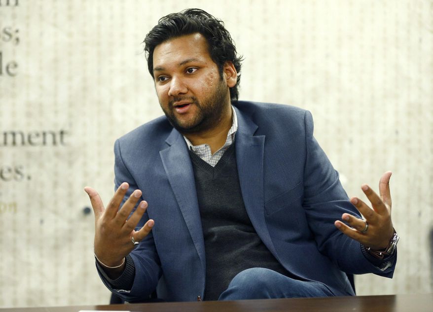 American Civil Liberties Union of New Jersey new executive director Amol Sinha participates in an Abury Park Press editorial board meeting in Neptune, NJ, Monday, Nov. 20, 2017. Sinha said says legalizing recreational marijuana would help fix "a racial justice issue and a civil rights crisis" because the war on drugs is disproportionately targeting black New Jerseyans. (Thomas P. Costello/The Asbury Park Press via AP)