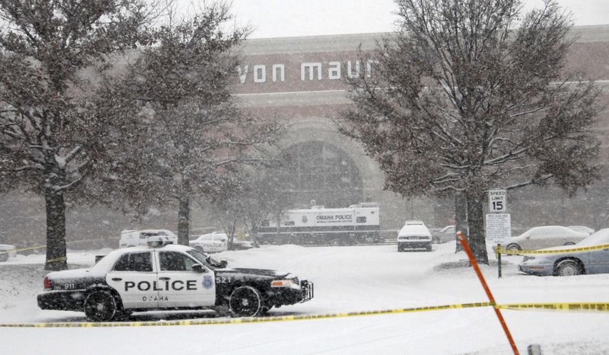 FILE - In this Dec. 6, 2017, file photo, Omaha Police Mobile Command Center is stationed outside the entrance to the Von Maur store at the Westroads Mall in Omaha, Neb., the site of yesterday's deadly shooting. Tuesday, Dec. 5, 2017, marks the 10th anniversary of Omaha’s deadliest shooting. (AP Photo/Dave Weaver, File)