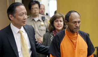 In this July 7, 2015, file photo, Jose Ines Garcia Zarate, right, is led into the courtroom by San Francisco Public Defender Jeff Adachi, left, and Assistant District Attorney Diana Garciaor, center, for his arraignment at the Hall of Justice in San Francisco. (Michael Macor/San Francisco Chronicle via AP, Pool, File)